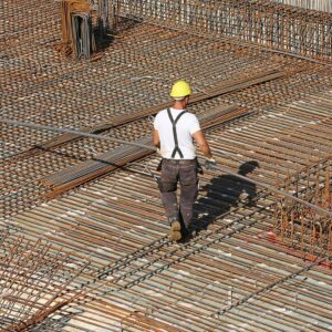 Rebar workers secure steel bars into concrete forms, which allows them to reinforce concrete for construction purposes. After the concrete cures, rebar workers use specially designed equipment to tighten and secure the bars.